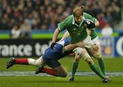 14 February 2004; Paul O'Connell, Ireland, is tackled by Fabien Pelous, France. RBS 6 Nations Championship 2003-2004, France v Ireland, Stade de France, St. Denis, Paris, France. Picture credit; Matt Browne / SPORTSFILE *EDI*