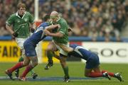 14 February 2004; John Hayes, Ireland, is tackled by Damien Traille,left, and Imanol Harinordoquy, France. RBS 6 Nations Championship 2003-2004, France v Ireland, Stade de France, St. Denis, Paris, France. Picture credit; Matt Browne / SPORTSFILE *EDI*