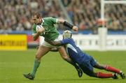14 February 2004; Keith Gleeson, Ireland, is tackled by Serge Betsen, France. RBS 6 Nations Championship 2003-2004, France v Ireland, Stade de France, St. Denis, Paris, France. Picture credit; Brendan Moran / SPORTSFILE *EDI*