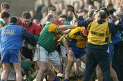 15 February 2004; Players and officials from both teams clash with each other at the end of the first half. AIB All-Ireland Club Senior Hurling Championship Semi-Final, Portumna v Dunloy, St. Tighernach's Park, Clones, Co. Monaghan. Picture credit; David Maher / SPORTSFILE *EDI*