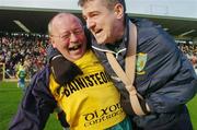15 February 2004; Dunloy manager Sean McLean, left, celebrates with injured player Liam Richmond at the end of the game after victory over Portumna. AIB All-Ireland Club Senior Hurling Championship Semi-Final, Portumna v Dunloy, St. Tighernach's Park, Clones, Co. Monaghan. Picture credit; David Maher / SPORTSFILE *EDI*