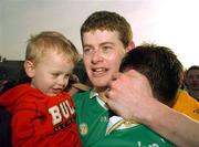 15 February 2004; Malachy Molloy, Dunloy captain, celebrates with his son Ronan at the end of the game after victory over Portumna. AIB All-Ireland Club Senior Hurling Championship Semi-Final, Portumna v Dunloy, St. Tighernach's Park, Clones, Co. Monaghan. Picture credit; David Maher / SPORTSFILE *EDI*