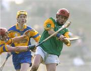 15 February 2004; Martin Curry, Dunloy, in action against Ollie Canning, Portumna. AIB All-Ireland Club Senior Hurling Championship Semi-Final, Portumna v Dunloy, St. Tighernach's Park, Clones, Co. Monaghan. Picture credit; David Maher / SPORTSFILE *EDI*
