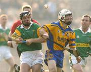 15 February 2004; Michael McClements, Dunloy, in acton against Damien Hayes, Portumna. AIB All-Ireland Club Senior Hurling Championship Semi-Final, Portumna v Dunloy, St. Tighernach's Park, Clones, Co. Monaghan. Picture credit; David Maher / SPORTSFILE *EDI*