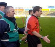15 February 2004; Referee Seamus Roche leaves the field at the end of the game accompanied by stewards. AIB All-Ireland Club Senior Hurling Championship Semi-Final, Newtownshandrum v O'Loughlin Gaels, Semple Stadium, Thurles, Co. Tipperary. Picture credit; Damien Eagers / SPORTSFILE *EDI*