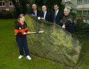16 February 2004; Hurling managers, from left, Brian Cody, Kilkenny, Dinny Cahill, Antrim, Humphrey Kelleher, Dublin and Pa Joe Whelahan, Limerick, watch as Lauren Gunning, aged 9, from St Olaf's in Dundrum, shows her skills at the launch of the 2004 Allianz National Hurling League at the Berkeley Court Hotel, Dublin. Picture credit; Brendan Moran / SPORTSFILE *EDI*