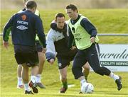 17 February 2004; Robbie Keane in action against Andy O'Brien, centre, and Richard Dunne, left, during Republic of Ireland soccer training. Malahide Football Club, Malahide, Co. Dublin. Picture credit; David Maher / SPORTSFILE *EDI*