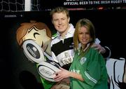 19 February 2004; Pictured at the Guinness Draught Can Skills Squads launch are Irish International Eric Miller and model Jenny Lee Masterson. The Skills Squads is an interactive fun street experience that will be touring the country prior to Ireland's home games during the Six Nations Championship. Fans will be asked to try their luck with their kicking, passing and throwing skills to see if they can match the international players and win two tickets to Ireland's final home international against Scotland on March 27th. Picture credit; Ray McManus / SPORTSFILE *EDI*