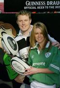 19 February 2004; Pictured at the Guinness Draught Can Skills Squads launch are Irish International Eric Miller and model Jenny Lee Masterson. The Skills Squads is an interactive fun street experience that will be touring the country prior to Ireland's home games during the Six Nations Championship. Fans will be asked to try their luck with their kicking, passing and throwing skills to see if they can match the international players and win two tickets to Ireland's final home international against Scotland on March 27th. Picture credit; Ray McManus / SPORTSFILE *EDI*