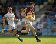 13 July 2013; Rory Quinlivan, Wexford, in action against Peter Foy, Longford. GAA Football All-Ireland Senior Championship, Round 2, Longford v Wexford, Glennon Brothers Pearse Park, Longford. Picture credit: Matt Browne / SPORTSFILE
