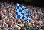14 July 2013; A Dublin supporter waves his flag during the game. Leinster GAA Football Senior Championship Final, Meath v Dublin, Croke Park, Dublin. Picture credit: Barry Cregg / SPORTSFILE