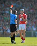 14 July 2013; Patrick Horgan, Cork, is shown a straight red card by referee James McGrath. Munster GAA Hurling Senior Championship Final, Limerick v Cork, Gaelic Grounds, Limerick. Picture credit: Diarmuid Greene / SPORTSFILE