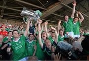 14 July 2013; Limerick captain Donal O'Grady, amongst team-mates, lifts the cup after victory over Cork. Munster GAA Hurling Senior Championship Final, Limerick v Cork, Gaelic Grounds, Limerick. Picture credit: Diarmuid Greene / SPORTSFILE