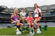 15 July 2013; Pictured at the launch are junior players, from left to right, Kellie Kearney, Wexford, Siobhan Flannery, Offaly, Grace Lynch, Louth, and Ashelene Groogan, Derry. September 29th will be the 40th time that the final of the Senior Ladies Gaelic Football Final will be contested. The first final took place in October 1974 and was contested by Tipperary and Offaly in a game that was won by the Tipperary women. The most successful team in the history of the game are Kerry who have won the title on 11 occasions including an unprecedented 9-in-a-row. In recent years Cork have been the dominant force winning 7 of the last 8 titles. TG4 made the announcement that RefCam will be introduced to Irish Sport for the first time. The lightweight head mounted device will be a feature of TG4’s live coverage of the 2013 Ladies Football Championship and will provide viewers with unique insight into the game but it will also be a hugely valuable coaching resource for referees. 2013 TG4 All-Ireland Ladies Football Championship Launch, Croke Park, Dublin. Picture credit: David Maher / SPORTSFILE