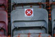 18 June 2021; A Covid-19 sign on a seat in the stand at the SSE Airtricity League Premier Division match between Bohemians and Drogheda United at Dalymount Park in Dublin. Photo by Piaras Ó Mídheach/Sportsfile