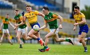 30 May 2021; Paudie Clifford of Kerry in action against Conor Cox, left, and Tadhg O'Rourke of Roscommon during the Allianz Football League Division 1 South Round 3 match between Roscommon and Kerry at Dr Hyde Park in Roscommon. Photo by Brendan Moran/Sportsfile