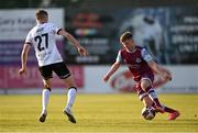 21 June 2021; Conor Kane of Drogheda United in action against Daniel Kelly of Dundalk during the SSE Airtricity League Premier Division match between Drogheda United and Dundalk at Head in the Game Park in Drogheda, Louth. Photo by Piaras Ó Mídheach/Sportsfile