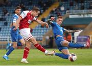 25 June 2021; Mattie Smith of St Patrick's Athletic has a shot on goal despite the attention of Kyle Ferguson of Waterford during the SSE Airtricity League Premier Division match between Waterford and St Patrick's Athletic at the RSC in Waterford. Photo by Michael P Ryan/Sportsfile