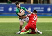 25 June 2021; Chris Cosgrave of Ireland is tackled by Joe Hawkins of Wales during the U20 Six Nations Rugby Championship match between Wales and Ireland at Cardiff Arms Park in Cardiff, Wales. Photo by Gareth Everett/Sportsfile