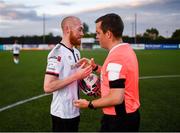 25 June 2021; Chris Shields of Dundalk having played his final game for the club, with referee Rob Harvey, after the SSE Airtricity League Premier Division match between Dundalk and Derry City at Oriel Park in Dundalk, Louth. Photo by Stephen McCarthy/Sportsfile