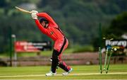 26 June 2021; Seamus Lynch of Munster Reds is bowled by Craig Young of North West Warriors during the Cricket Ireland InterProvincial Trophy 2021 match between North West Warriors and Munster Reds at Bready Cricket Club in Magheramason, Tyrone. Photo by Harry Murphy/Sportsfile