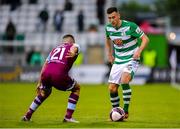 25 June 2021; Aaron Greene of Shamrock Rovers in action against Luke Heeney of Drogheda United during the SSE Airtricity League Premier Division match between Shamrock Rovers and Drogheda United at Tallaght Stadium in Dublin. Photo by Seb Daly/Sportsfile