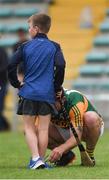 26 June 2021; Mikey Boyle of Kerry ties the shoes of his son Bobby, aged 8, after the Joe McDonagh Cup Round 1 match between Kerry and Down at Austin Stack Park in Tralee, Kerry. Photo by Daire Brennan/Sportsfile