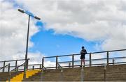 26 June 2021; Kerry supporter Donnacha Buttimer, aged 14, from Tralee, Co Kerry, takes note of a score on his prograrmme during the Joe McDonagh Cup Round 1 match between Kerry and Down at Austin Stack Park in Tralee, Kerry. Photo by Daire Brennan/Sportsfile