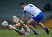26 June 2021; Iain Corbett of Limerick in action against Darach Ó Cathasaigh of Waterford during the Munster GAA Football Senior Championship Quarter-Final match between Limerick and Waterford at LIT Gaelic Grounds in Limerick. Photo by Piaras Ó Mídheach/Sportsfile
