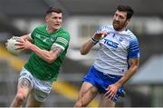 26 June 2021; Iain Corbett of Limerick in action against Tommy Prendergast of Waterford during the Munster GAA Football Senior Championship Quarter-Final match between Limerick and Waterford at LIT Gaelic Grounds in Limerick. Photo by Piaras Ó Mídheach/Sportsfile