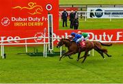 26 June 2021; Hurricane Lane and jockey William Buick pass the post to win the Dubai Duty Free Irish Derby, from second place, Lone Eagle, with Frankie Dettori up, day two of the Dubai Duty Free Irish Derby Festival at The Curragh Racecourse in Kildare. Photo by Seb Daly/Sportsfile