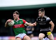 26 June 2021; Darren McHale of Mayo in action against Karl McKenna of Sligo during the Connacht GAA Football Senior Championship Quarter-Final match between Sligo and Mayo at Markievicz Park in Sligo. Photo by David Fitzgerald/Sportsfile