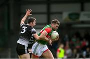 26 June 2021; Aidan O'Shea of Mayo in action against Eddie McGuinness of Sligo during the Connacht GAA Football Senior Championship Quarter-Final match between Sligo and Mayo at Markievicz Park in Sligo. Photo by David Fitzgerald/Sportsfile