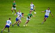 26 June 2021; Iain Corbett of Limerick passes under pressure from Michael Curry of Waterford, left, during the Munster GAA Football Senior Championship Quarter-Final match between Limerick and Waterford at LIT Gaelic Grounds in Limerick. Photo by Piaras Ó Mídheach/Sportsfile