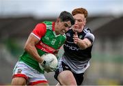 26 June 2021; Tommy Conroy of Mayo in action against Evan Lyons of Sligo during the Connacht GAA Football Senior Championship Quarter-Final match between Sligo and Mayo at Markievicz Park in Sligo. Photo by David Fitzgerald/Sportsfile