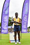 26 June 2021; Israel Olatunde of UCD AC, Dublin, pictured with the trophy after winning the Men's 100m during day two of the Irish Life Health National Senior Championships at Morton Stadium in Santry, Dublin. Photo by Sam Barnes/Sportsfile