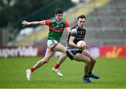 26 June 2021; Cian Lally of Sligo in action against Conor Loftus of Mayo the Connacht GAA Football Senior Championship Quarter-Final match between Sligo and Mayo at Markievicz Park in Sligo. Photo by David Fitzgerald/Sportsfile