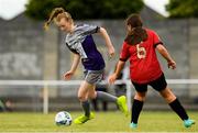 26 June 2021; Lisa Coen of Galway WFC in action against Caoimhe Creighton of Bohemians during the EA SPORTS Women's National U17 League match between Bohemians and Galway WFC at Oscar Traynor Centre in Dublin. Photo by Matt Browne/Sportsfile