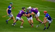 26 June 2021; Donnchadh Hartnett of Laois prepares to clear under pressure from Wexford players Mikie Dwyer , left, and Rory O'Connor during the Leinster GAA Hurling Senior Championship Quarter-Final match between Wexford and Laois at UPMC Nowlan Park in Kilkenny. Photo by Ray McManus/Sportsfile