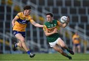 26 June 2021; Paudie Clifford of Kerry in action against Cillian Rouine of Clare during the Munster GAA Football Senior Championship Quarter-Final match between Kerry and Clare at Fitzgerald Stadium in Killarney, Kerry.Photo by Dáire Brennan/Sportsfile