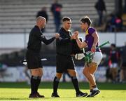 26 June 2021; Conor McDonald of Wexford greets sideline official Nicky O'Toole and standby referee John Keenan after  the Leinster GAA Hurling Senior Championship Quarter-Final match between Wexford and Laois at UPMC Nowlan Park in Kilkenny. Photo by Ray McManus/Sportsfile