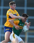 26 June 2021; Brian Ó Beaglaoich of Kerry in action against Emmet McMahon of Clare during the Munster GAA Football Senior Championship Quarter-Final match between Kerry and Clare at Fitzgerald Stadium in Killarney, Kerry. Photo by Dáire Brennan/Sportsfile