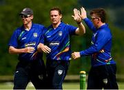 27 June 2021; Graham Hume of North West Warriors, centre, celebrates with team-mates Craig Young and Nathan McGuire after taking the wicket of Kevin O'Brien of Leinster Lightning during the Cricket Ireland InterProvincial Trophy 2021 match between North West Warriors and Leinster Lightning at Bready Cricket Club in Magheramason, Tyrone. Photo by Harry Murphy/Sportsfile