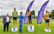 26 June 2021; Athletics Ireland Preident John Cronin, left, with Men's 100m medallists, from left, Stephen Gaffney of Rathfarnham WSAF AC, Dublin, silver, Israel Olatunde of UCD AC, Dublin, gold, and Conor Morey of Leevale AC, Cork, bronze, as Tullamore Harriers Chairman Adrian Curley presents the trophy during day two of the Irish Life Health National Senior Championships at Morton Stadium in Santry, Dublin. Photo by Sam Barnes/Sportsfile