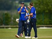 27 June 2021; Craig Young of North West Warriors, right, celebrates with team-mate Shane Getkate after catching out Lorcan Tucker of Leinster Lightning during the Cricket Ireland InterProvincial Trophy 2021 match between North West Warriors and Leinster Lightning at Bready Cricket Club in Magheramason, Tyrone. Photo by Harry Murphy/Sportsfile