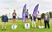 26 June 2021; Sport Ireland chief executive John Treacy, far left, and Athletics Ireland President John Cronin, far right, with Men's 1500m medallists, from left, Cathal Doyle of Clonliffe Harriers AC, Dublin, silver, Andrew Coscoran of Star of the Sea AC, Meath, gold, Kevin Kelly of St. Coca's AC, Kildare, bronze, as Willie Smith presents the cup during day two of the Irish Life Health National Senior Championships at Morton Stadium in Santry, Dublin. Photo by Sam Barnes/Sportsfile