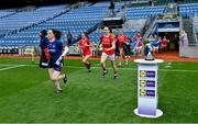 26 June 2021; The Cork team run out past the Division 1 trophy before the Lidl Ladies Football National League Division 1 Final match between Cork and Dublin at Croke Park in Dublin. Photo by Brendan Moran/Sportsfile