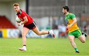 27 June 2021; Liam Kerr of Down in action against Ryan McHugh of Donegal during the Ulster GAA Football Senior Championship Preliminary Round match between Down and Donegal at Páirc Esler in Newry, Down. Photo by Ramsey Cardy/Sportsfile
