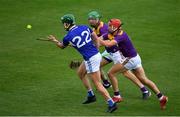 26 June 2021; James Ryan of Laois in action against Ciaran McEvoy and Paddy Purcell of Laois, right, during the Leinster GAA Hurling Senior Championship Quarter-Final match between Wexford and Laois at UPMC Nowlan Park in Kilkenny. Photo by Ray McManus/Sportsfile