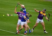 26 June 2021; Wexford players Conor McDonald and Mikie Dwyer, right, in action against Laois players Donnchadh Hartnett and Ryan Mullaney during the Leinster GAA Hurling Senior Championship Quarter-Final match between Wexford and Laois at UPMC Nowlan Park in Kilkenny. Photo by Ray McManus/Sportsfile